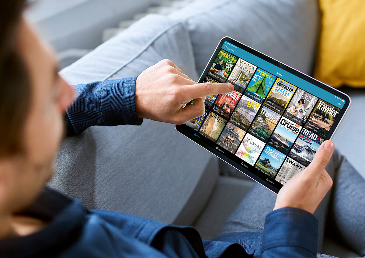 Illustration: Man perusing electronic magazines on a tablet