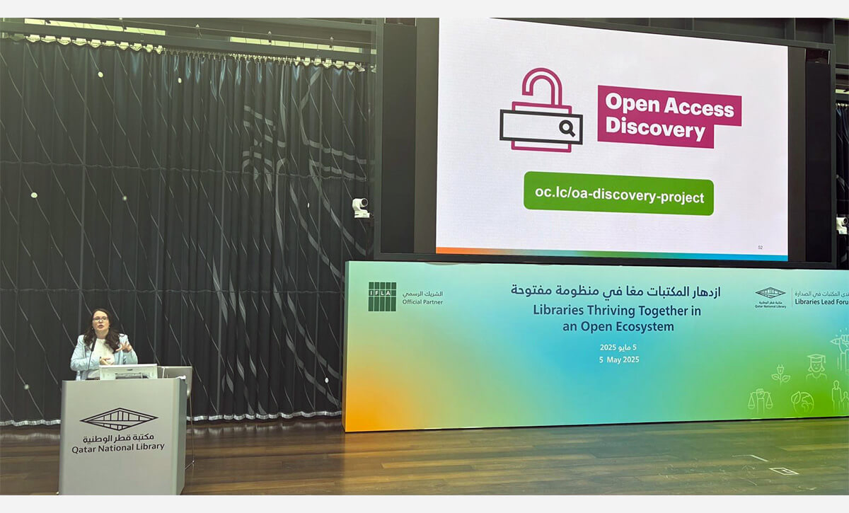 Photo: OCLC presentation onstage at Libraries Lead Forum in Qatar